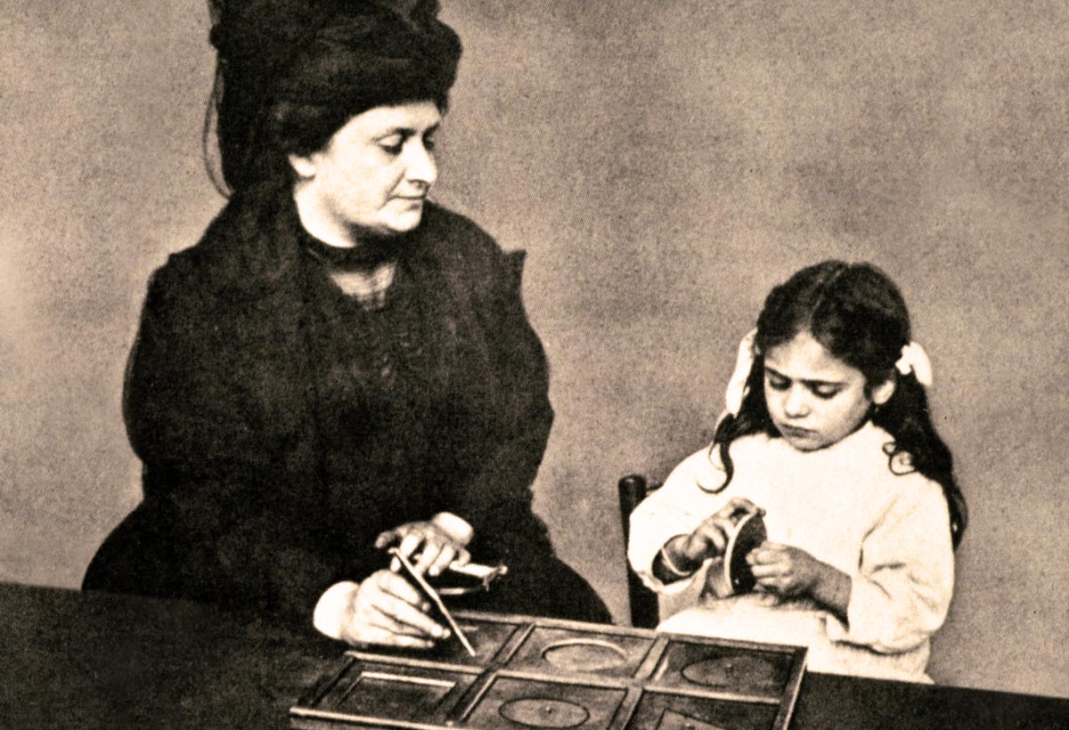 Maria Montessori teaching student